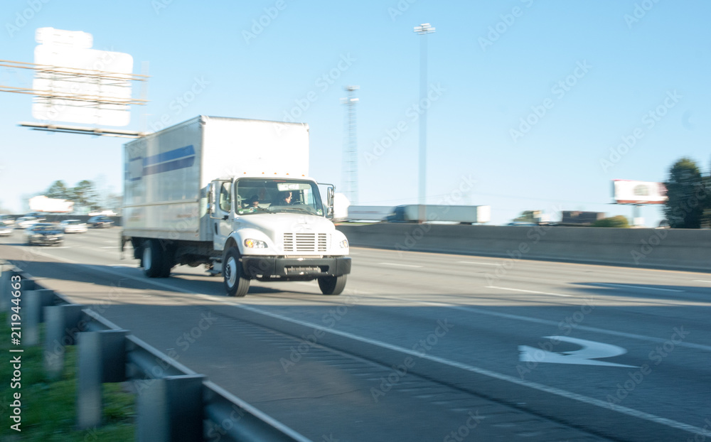 This image shows a heavy truck on the highway. 