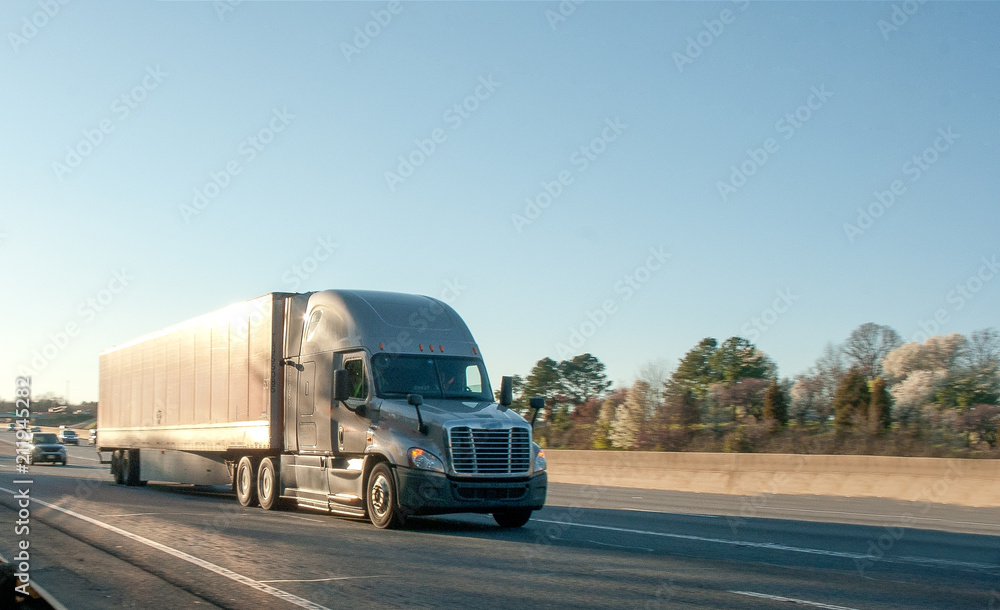 This image shows a heavy truck on the highway. 