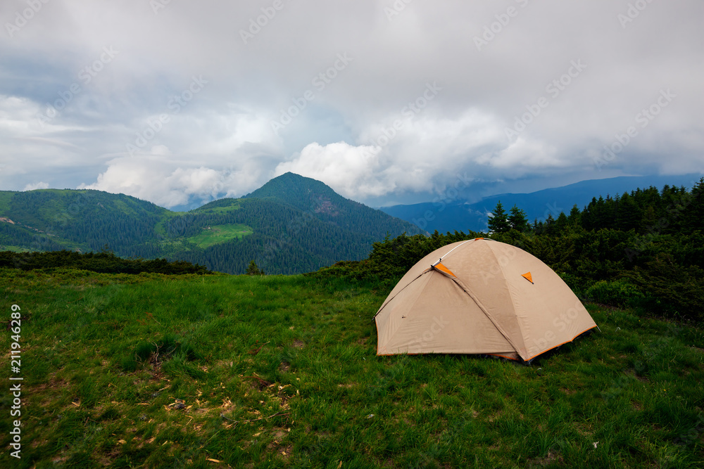Tent on the green mountain meadow Tent on the green mountain meadow