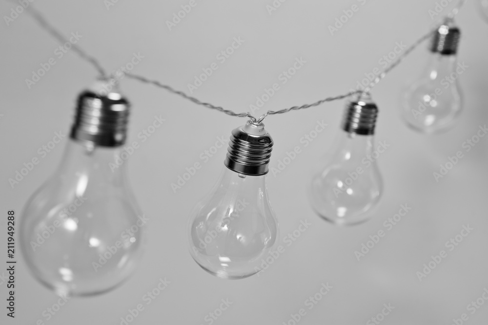 Black and white photo of a garland of incandescent lamps Black and white photo of a garland of incandescent lamps