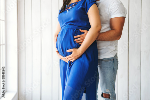 Cute pregnant woman hug with her husband