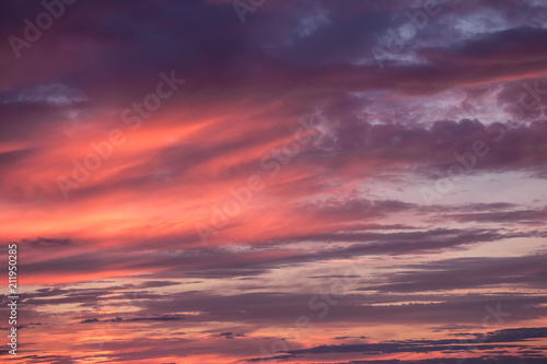 Scenic view at purple cloudy sunset sky. Abstract nature background. Sunset or sunrise dramatic sky with clouds.