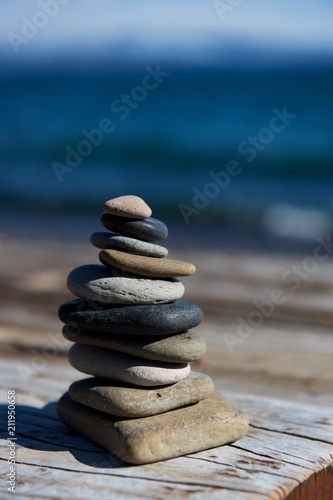 rocks stacked in front of water