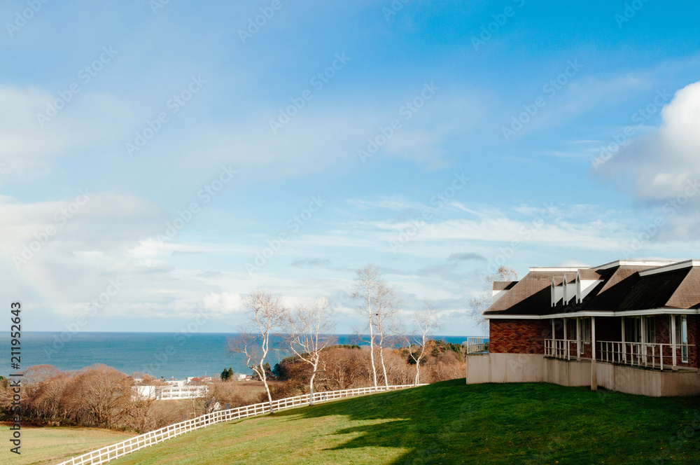 Scenery of lake Toya with beautiful design building on green hill, Hokkaido