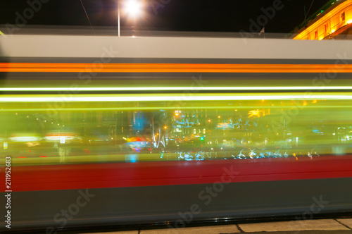 Blurry lights city tram at night