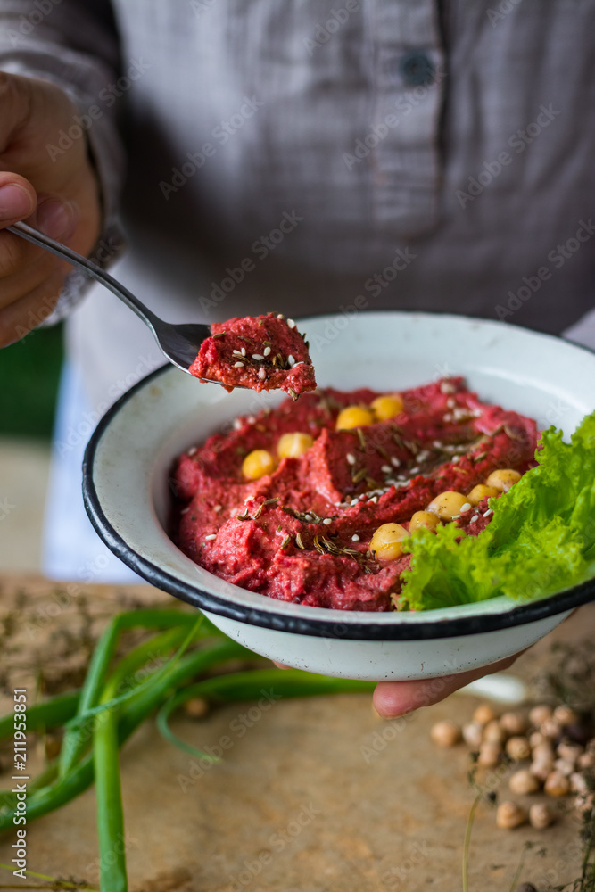 Pkhali ingredients: cilantro mixed with onion, garlic and green adjika, pomegranate, walnuts. Traditional Georgian food appetizer. Preparation process. Pkhali ingredients: cilantro mixed with onion, garlic and green adjika, pomegranate, walnuts. Traditional Georgian food appetizer. Preparation process.