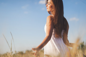 Young beautiful woman spending time in nature