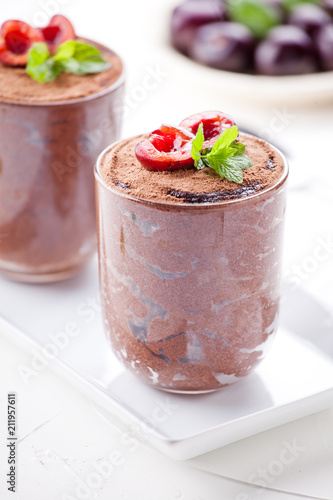 Couple Of Glasses Of Chocolate Mousse With Organic Cherries