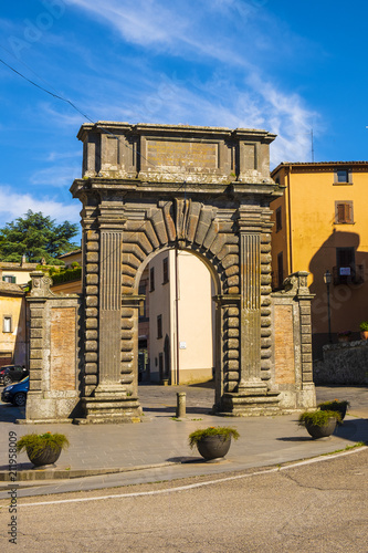 Bagnoregio, Italy - Ancient Roman gate arch in historic center of old town quarter at Piazza di Porta Albana square