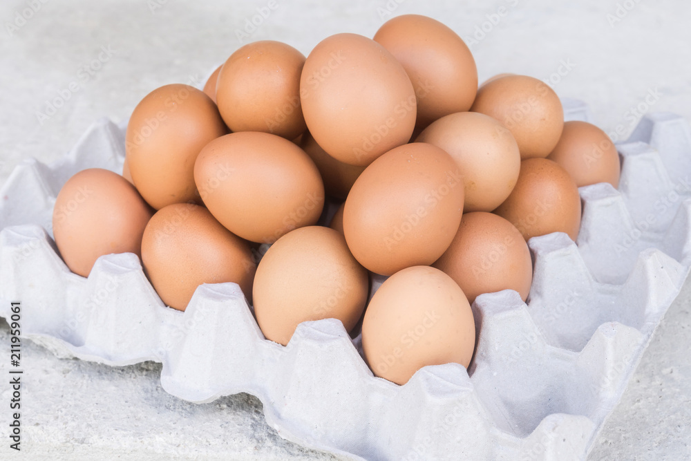 Close-up view of raw chicken eggs in egg box Close-up view of raw chicken eggs in egg box
