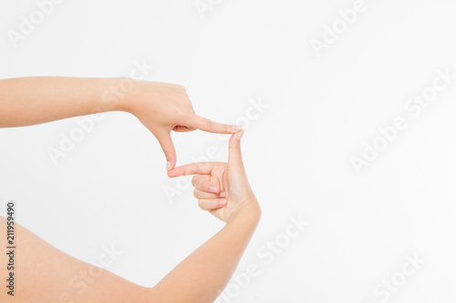 Female hands framing comosition. Isolated on white background. Copy space. Mock up.