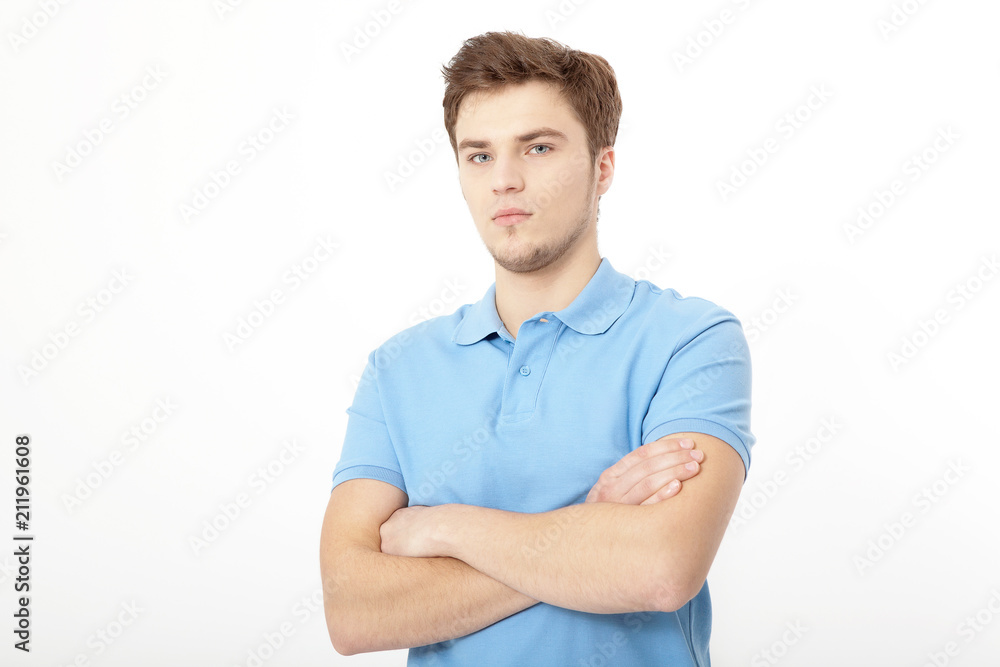 Smiling young man portrait isolated on white background. Copy space. Mock up. Handsome guy. Summer shirt clothes. Crossed arms Smiling young man portrait isolated on white background. Copy space. Mock up. Handsome guy. Summer shirt clothes. Crossed arms