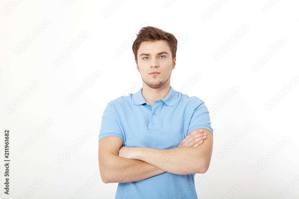 Smiling young man portrait isolated on white background. Copy space. Mock up. Handsome guy. Summer shirt clothes. Crossed arms Smiling young man portrait isolated on white background. Copy space. Mock up. Handsome guy. Summer shirt clothes. Crossed arms