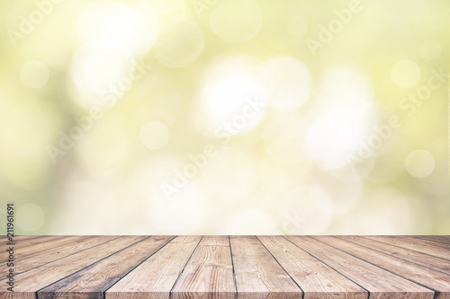 Wood table top and abstract nature blurred bokeh