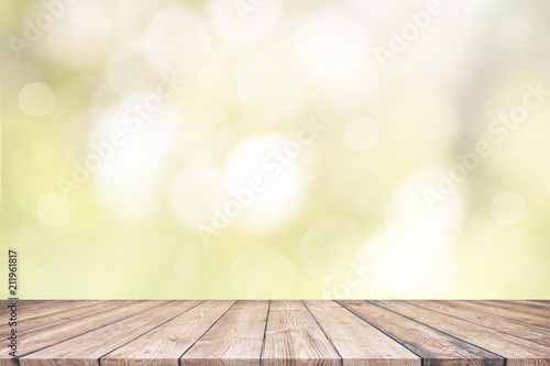 Wood table top on natural blurred bokeh 