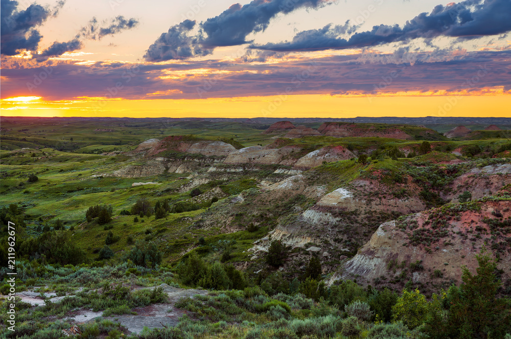 The sun sets over the Petrified Forest Trail at Theodore Roosevelt National Park