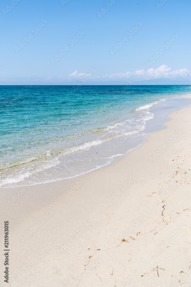 Beautiful empty sandy beach and turquoise sea Beautiful empty sandy beach and turquoise sea