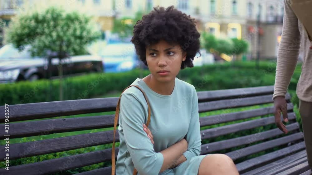 Upset woman leaving boyfriend being late for date, relations conflict, fight Upset woman leaving boyfriend being late for date, relations conflict, fight