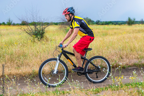 Cyclist riding a bike, cycling.