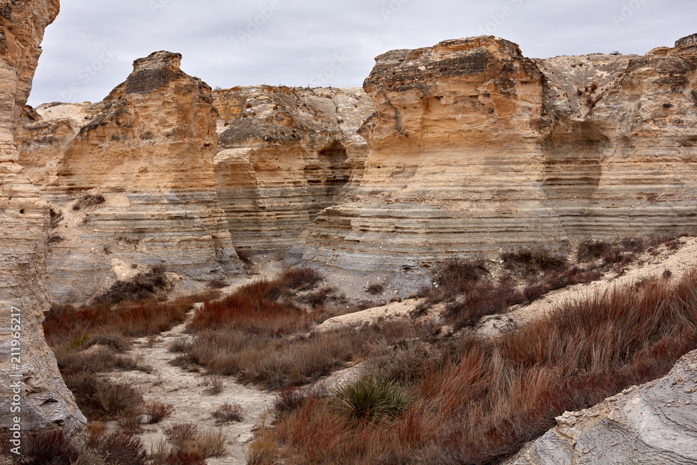 Fototapeta premium Scenic Valley Surrounded by Eroded Rock Formations