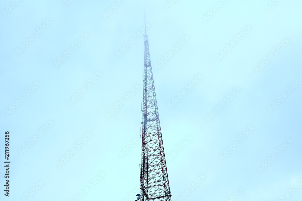Broadcast Tower Disappearing into Cloud Cover
