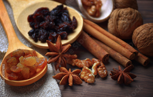 Anise stars, nuts, cinnamon, raisins for baking and cooking. Aromas of homemade food. Shallow depth of field.