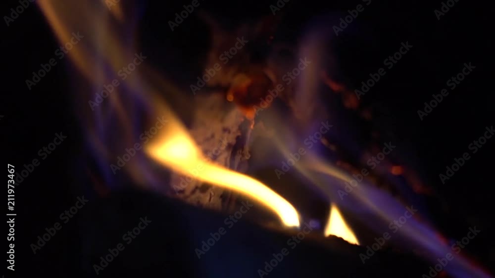 Hot coals & fire burning in the fireplace background. Hot coals & fire burning in the fireplace background.