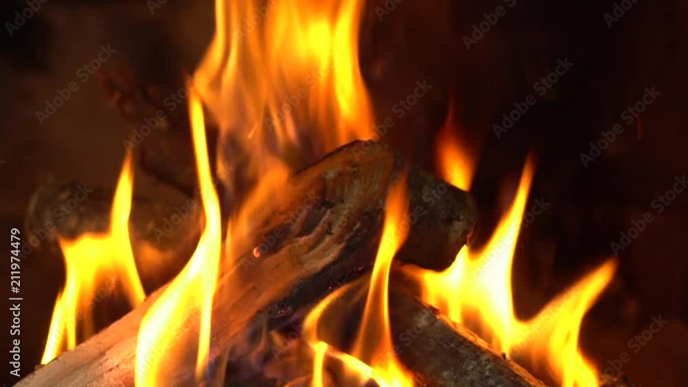 Hot coals & fire burning in the fireplace background. Hot coals & fire burning in the fireplace background.