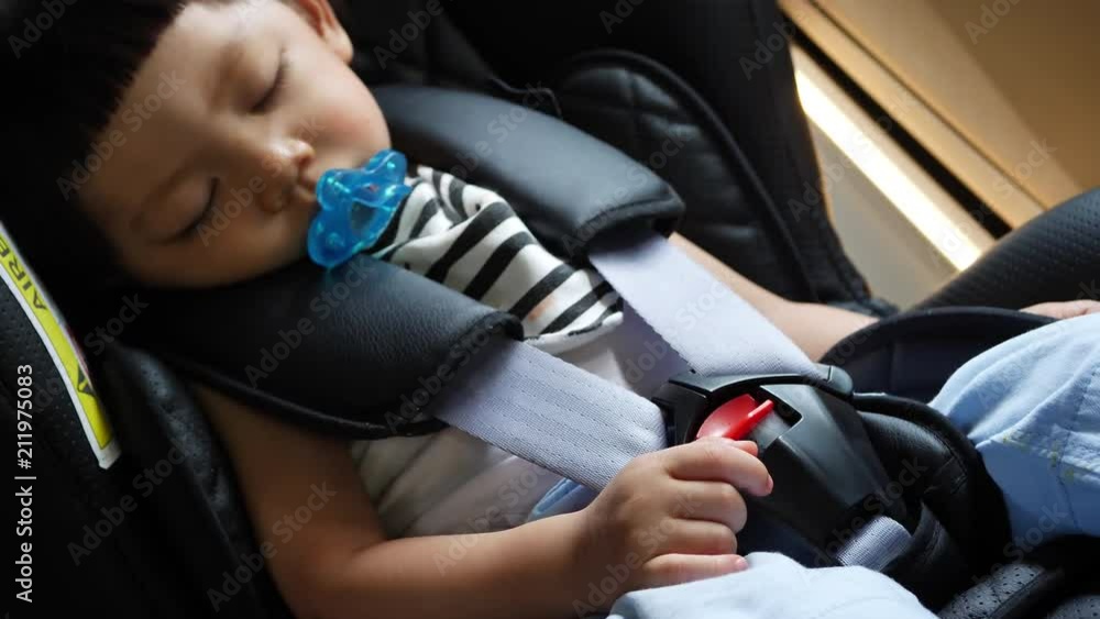 cute child sleeping in car seat cute child sleeping in car seat