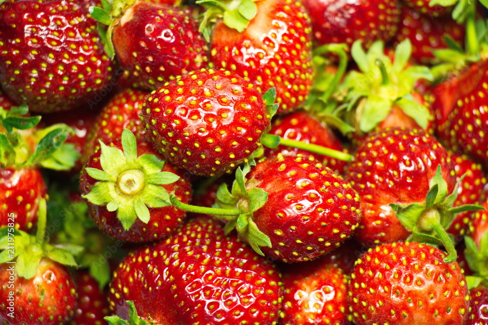 large berries of strawberry background large berries of strawberry background