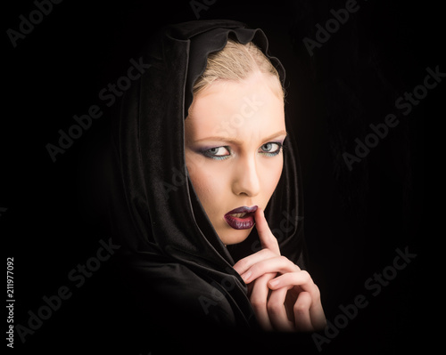 Woman in black hood - gothic style. fashion photo