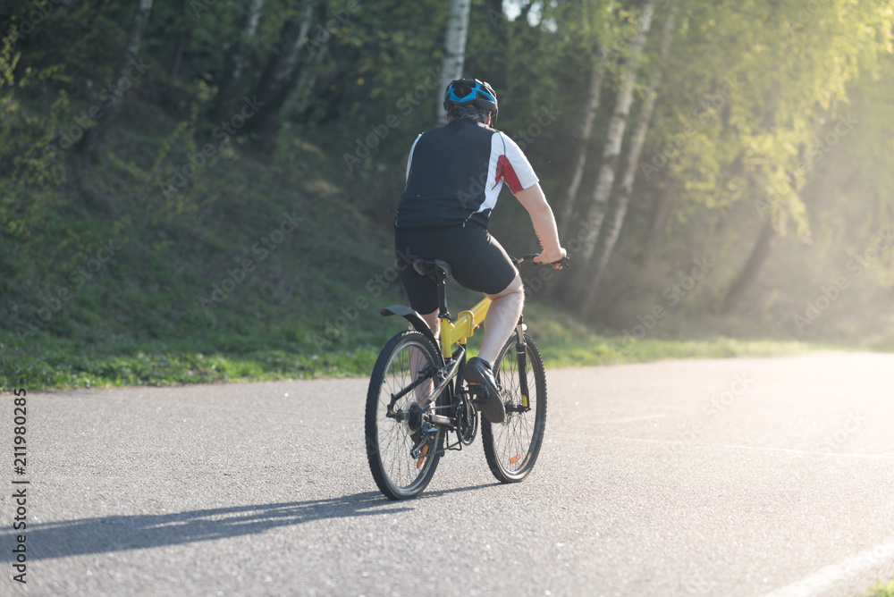 Cyclist riding a bike on a special training bicycle road in Moscow Cyclist riding a bike on a special training bicycle road in Moscow