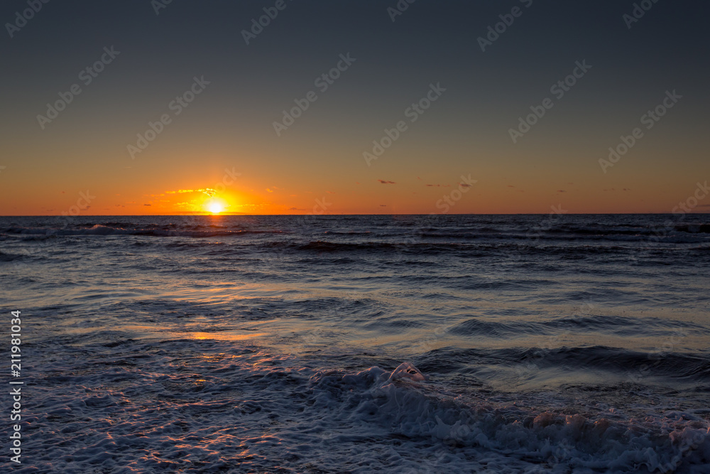 Beautiful sunset over Baltic Sea in Miedzyzdroje in Poland Beautiful sunset over Baltic Sea in Miedzyzdroje in Poland