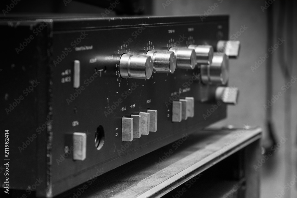 Old stereo amplifier in black with silver handles Old stereo amplifier in black with silver handles
