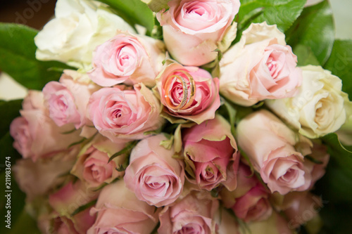 roses wedding bouquet and marriage rings