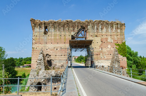 The ruins of Visconti bridge of Valeggio sul Mincio at Borghetto seen from the top of bridge, Italy photo