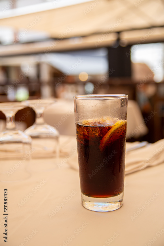 Glass of cold drink in street cafe. Glass of cold drink in street cafe.