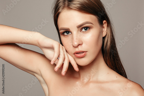 Beauty Woman face Portrait. Beautiful model Girl with Perfect Fresh Clean Skin color lips purple red. Pretty spa model girl with perfect fresh clean skin. Youth and skin care concept