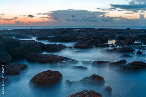 long exposure shooting of small island and rock and soft sea water with blue sky, Sky burst, blurred motion