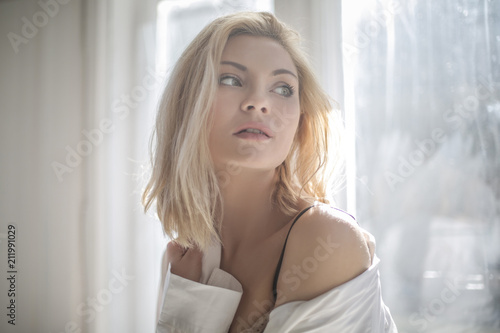 Portrait of an attractive woman looking out of the window
