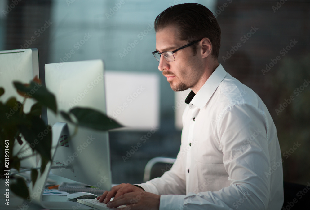 close up.thoughtful businessman looking at the computer monitor close up.thoughtful businessman looking at the computer monitor