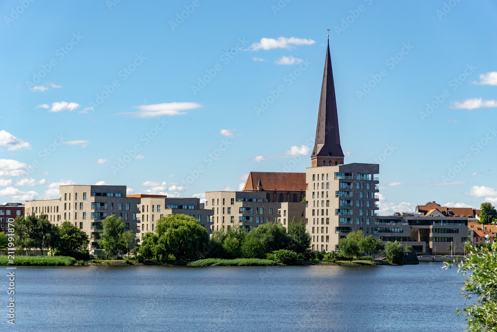 view over the river warnow - skyline of Rostock with Petri church in the background