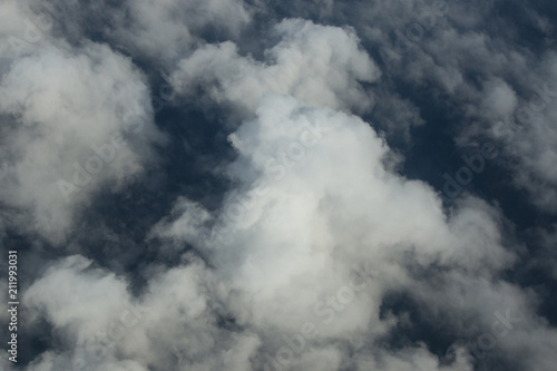 Beautiful white clouds forming and moving in blue sky 