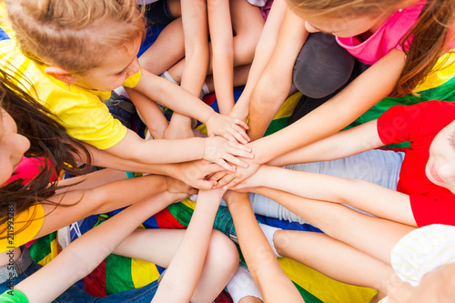 Close view of children's hand together photo