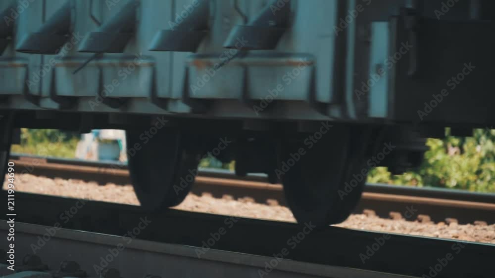 The wheels of the train by rail. Wagons move on rails The wheels of the train by rail. Wagons move on rails
