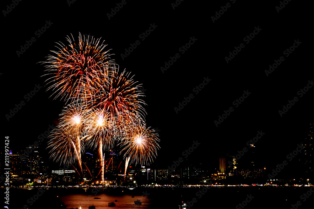 Many flashing fireworks with night cityscape background celebrate New Year. Many flashing fireworks with night cityscape background celebrate New Year.