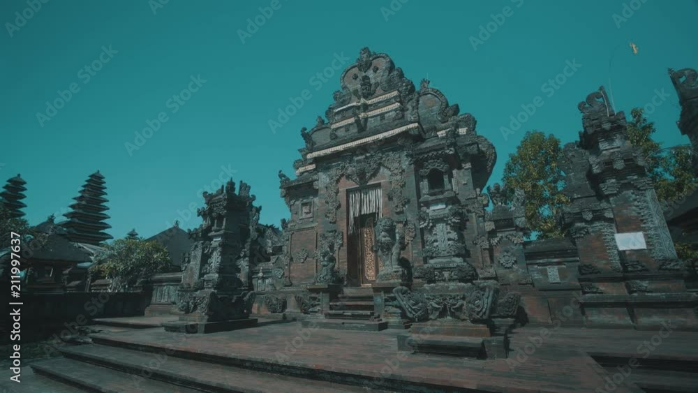 Main entrance of beautiful Pura Ulun Danu Bratan Temple over blue sky background in Bali, Indonesia Main entrance of beautiful Pura Ulun Danu Bratan Temple over blue sky background in Bali, Indonesia