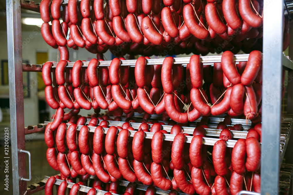 Smoked sausage in the oven. Sausage production in the factory.