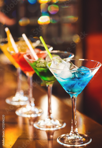 Multicolored cocktails at the bar.