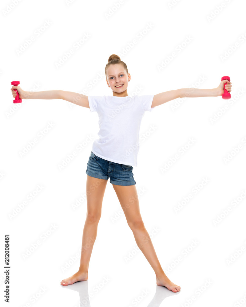 Little girl doing exercises with dumbbells. Little girl doing exercises with dumbbells.